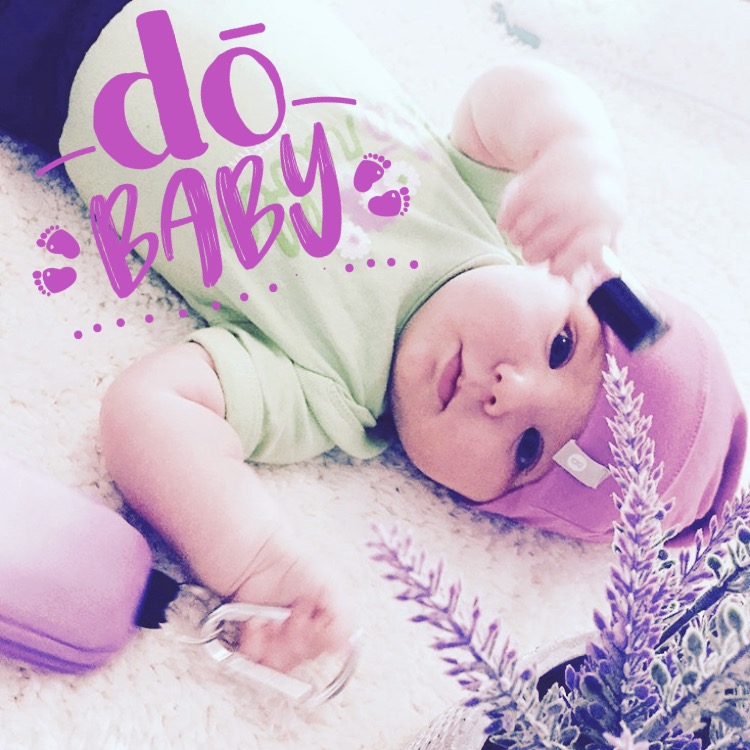 Styled baby portrait with soft pastel tones and a playful branded layout.